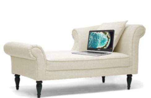 Virtual therapy session on couch with laptop